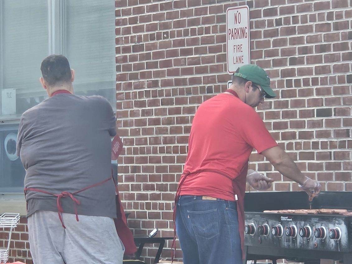 Members cooking outdoors